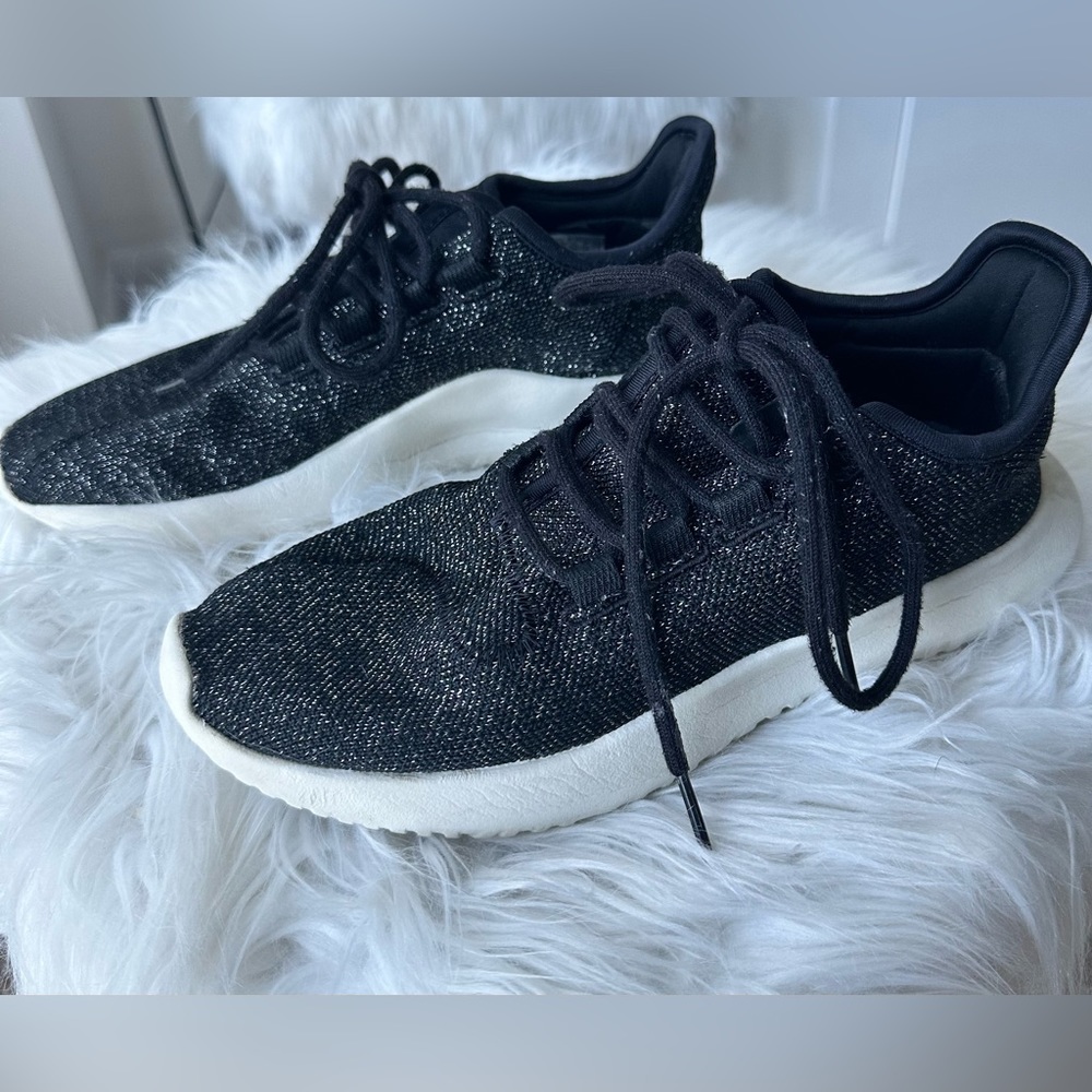 - Adidas black and silver sneakers